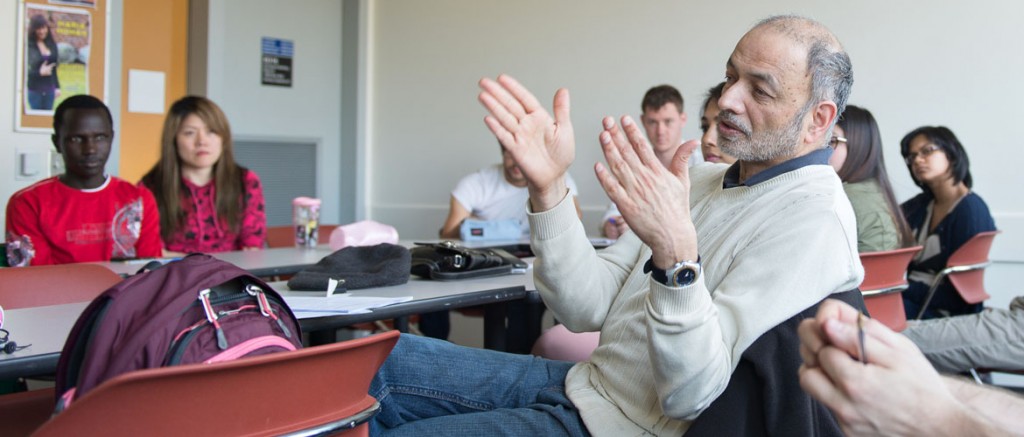Professor Ashok Kotwal guides the discussion in an ECON255 seminar.